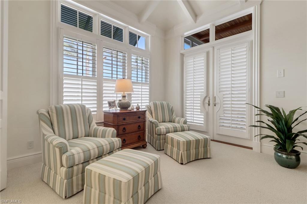 2621 Windward Way Naples, FL 34103 - Photo 16 of 37 a bedroom with furniture and a large window