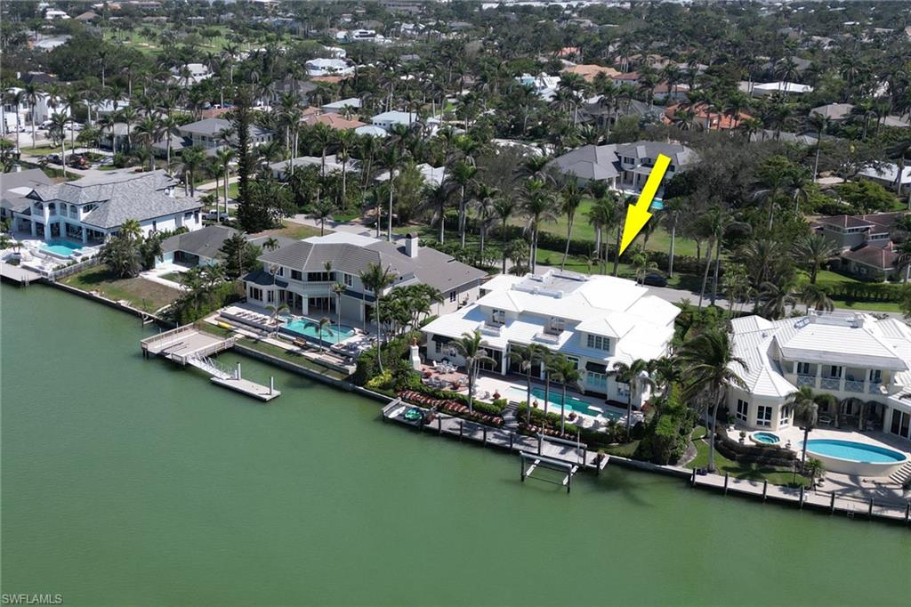2621 Windward Way Naples, FL 34103 - Photo 3 of 37 a aerial view of residential houses with outdoor space and lake view