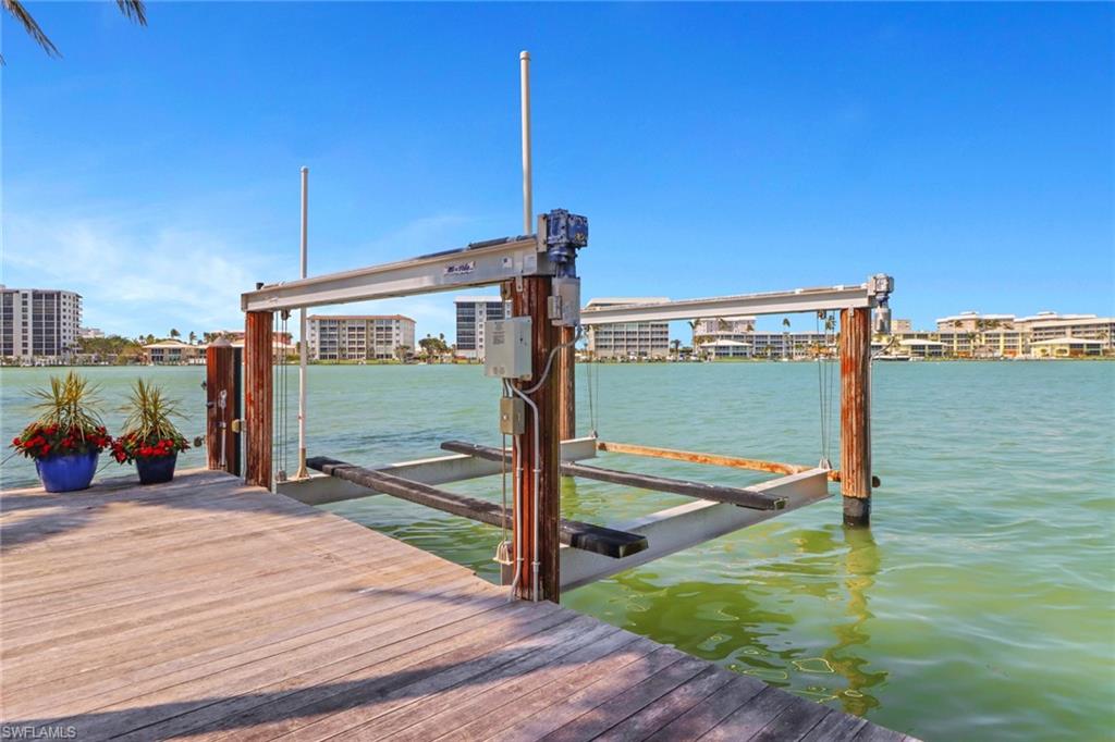 2621 Windward Way Naples, FL 34103 - Photo 32 of 37 a view of a balcony with floor to ceiling window