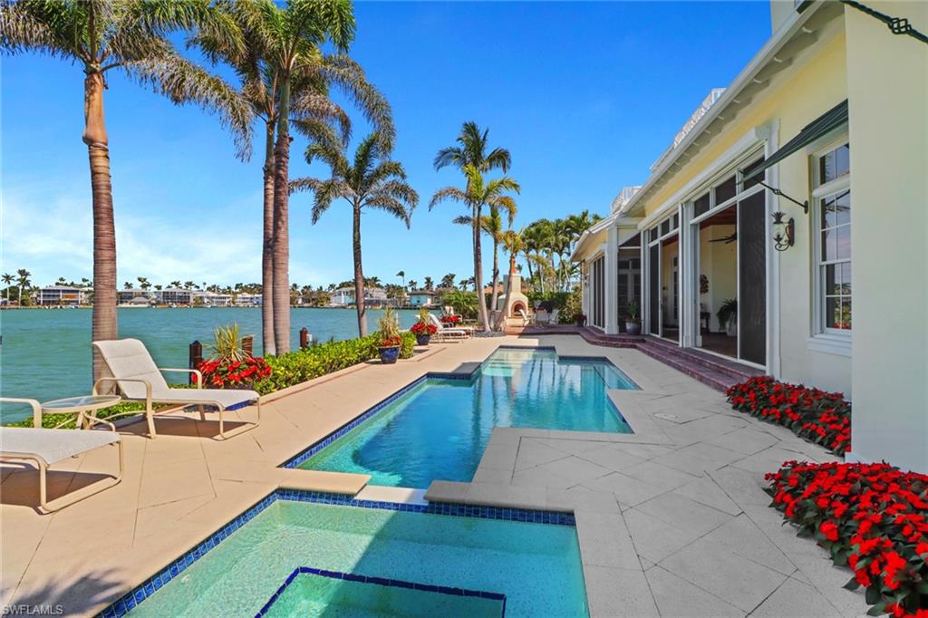 2621 Windward Way Naples, FL 34103 - Photo 34 of 37 a view of swimming pool with chairs