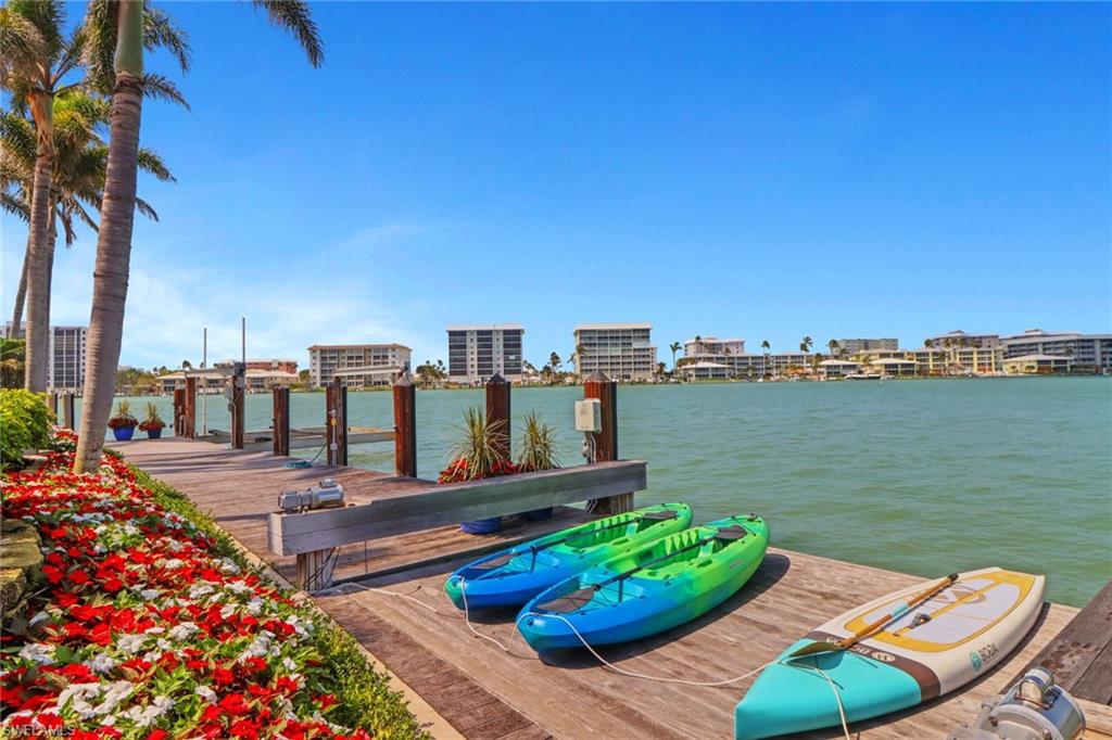 2621 Windward Way Naples, FL 34103 - Photo 7 of 37 a balcony with furniture and city view