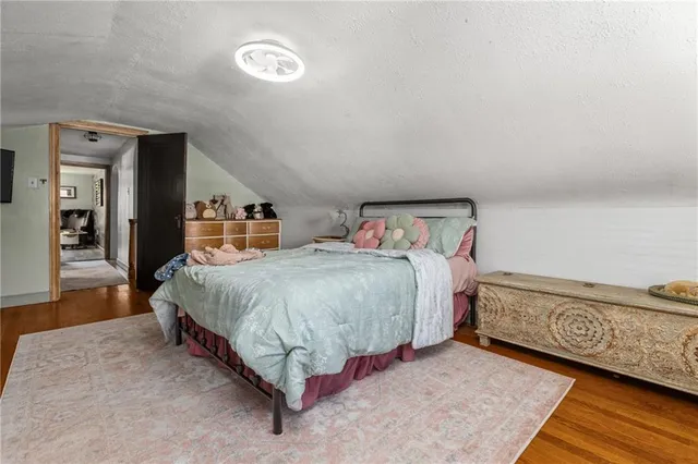 a spacious bedroom with a bed and a walk in closet