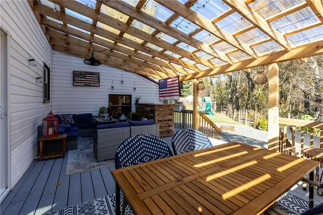 a outdoor space with lots of furniture and wooden floor