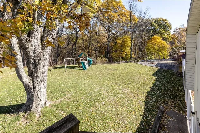 a backyard of a house with lots of green space