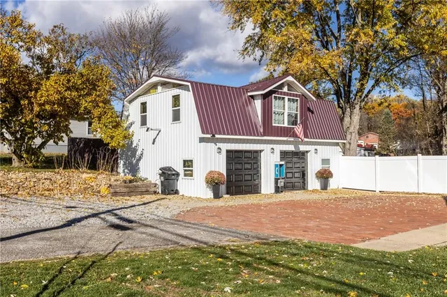 a view of a house with snow on the road
