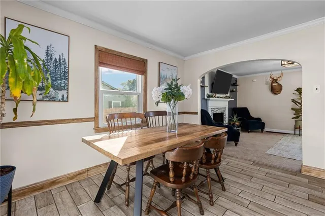 a view of a dining room with furniture window and wooden floor