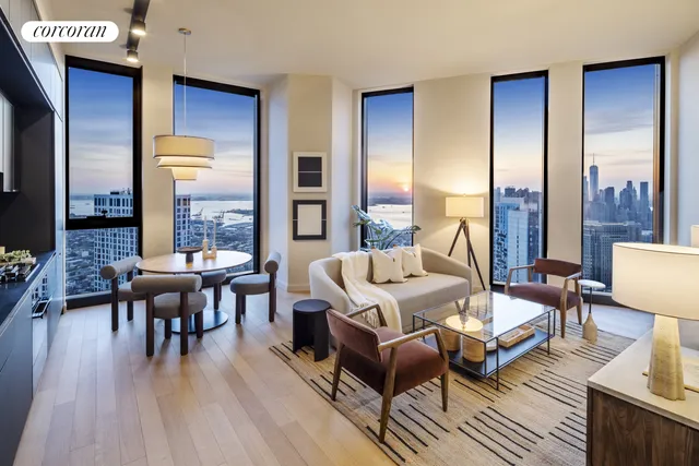 a living room with furniture fireplace and a table