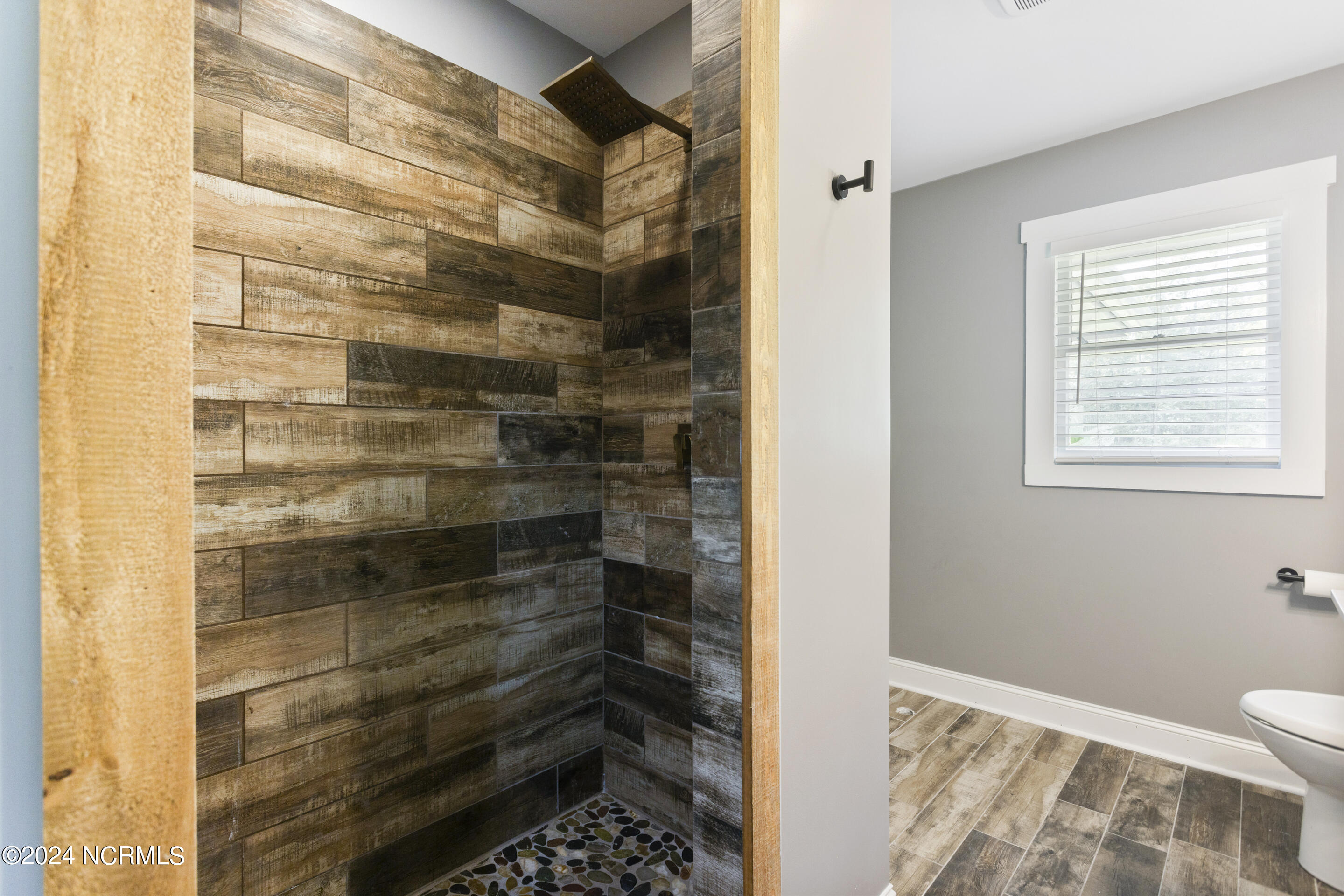 4222 Castle Hayne Road Castle Hayne, NC 28429 - Photo 23 of 52 Tiled shower in guest bathroom