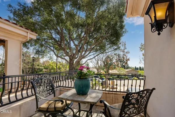 a view of a balcony with furniture