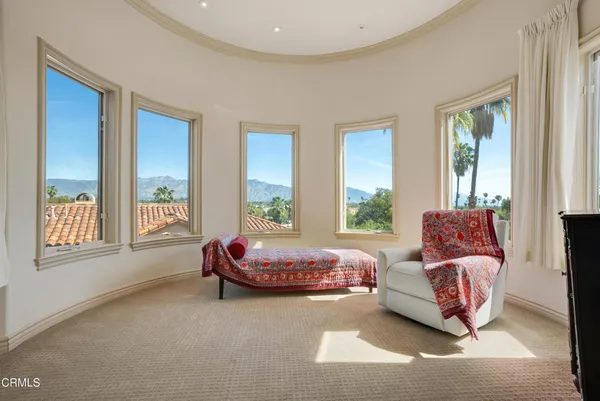 a living room with furniture and windows