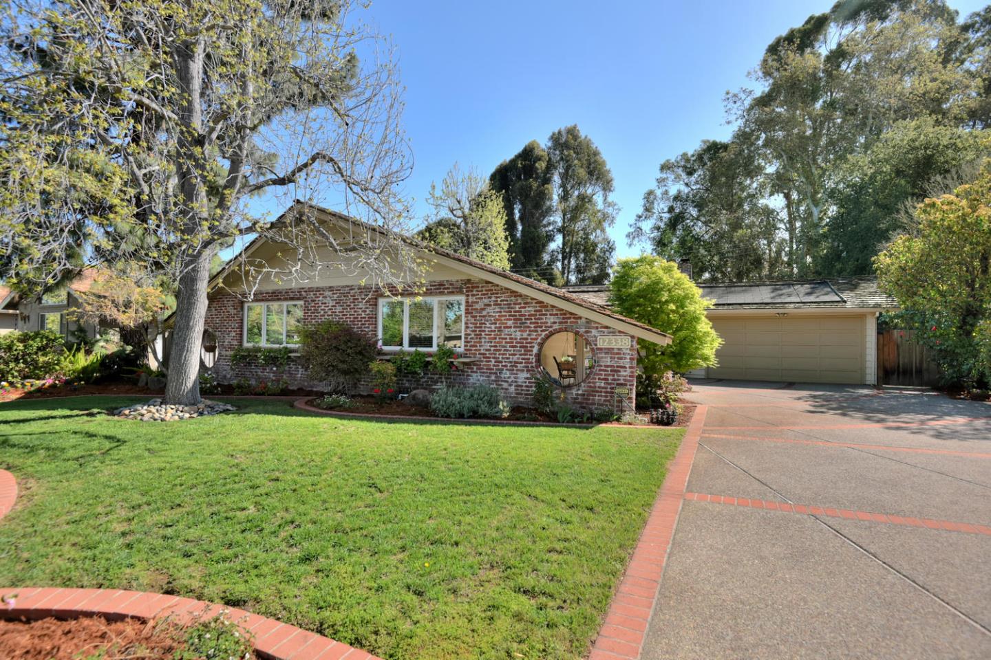a front view of a house with garden