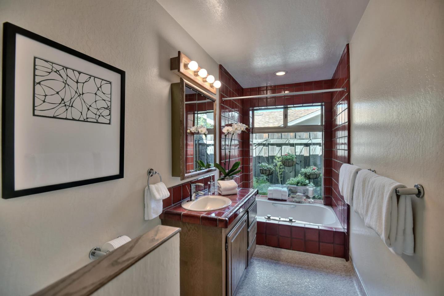 12338 Brookglen Drive Saratoga, CA 95070 - Photo 13 of 18 a bathroom with a sink and a bathtub