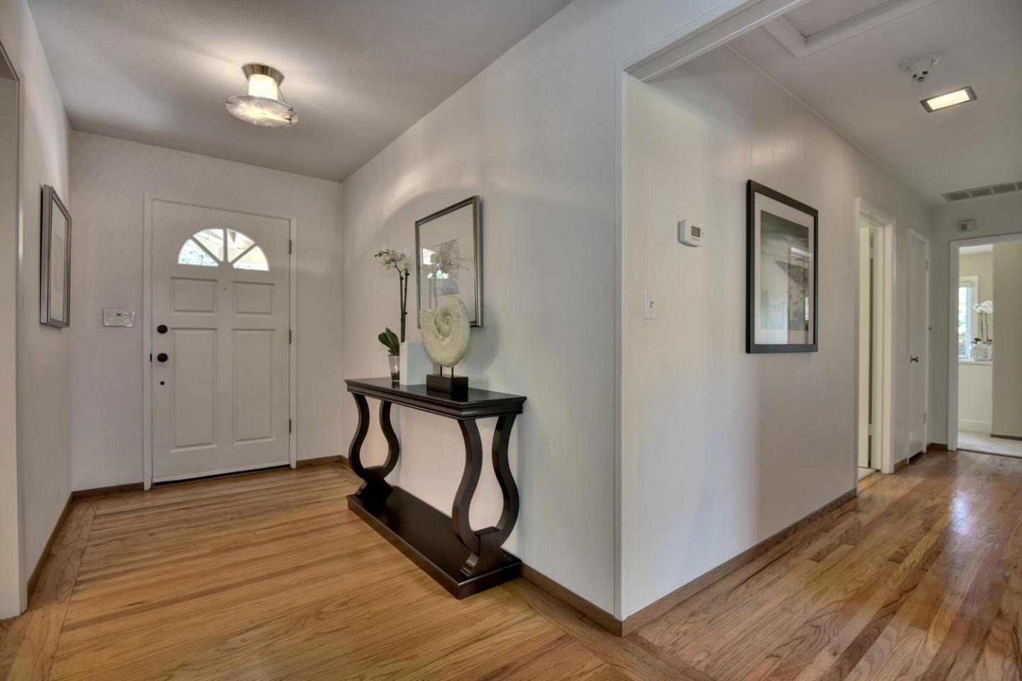 12338 Brookglen Drive Saratoga, CA 95070 - Photo 2 of 18 a view of a room with wooden floor and furniture