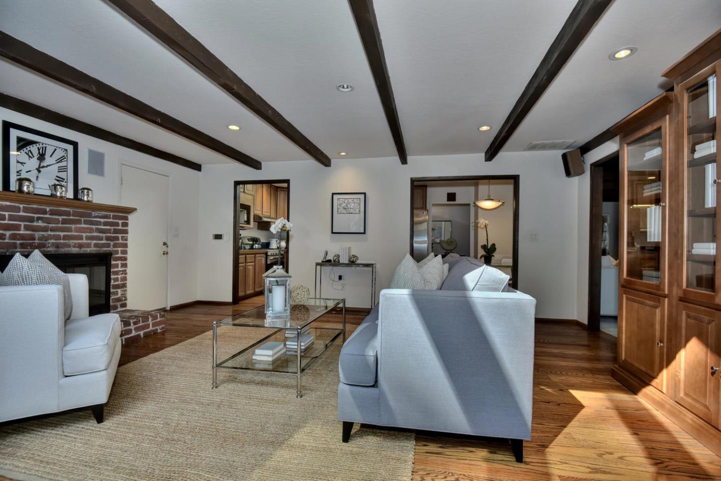 12338 Brookglen Drive Saratoga, CA 95070 - Photo 6 of 18 a living room with furniture and a fireplace