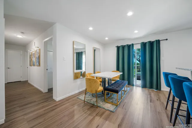 a view of a dining room with furniture window and wooden floor
