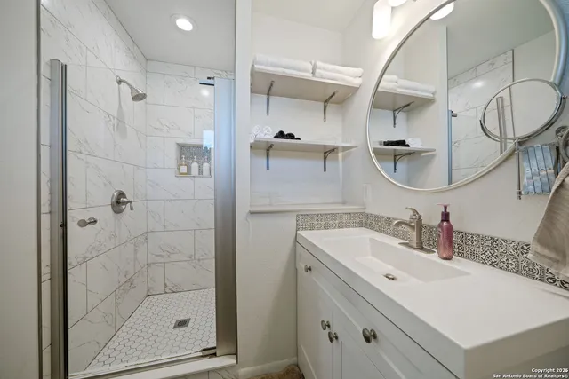 a bathroom with a sink and a mirror