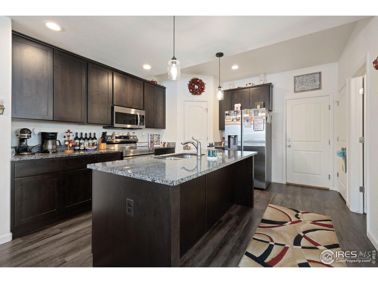 4355 24th Street Road, Unit 3404 Greeley, CO 80634 - Photo 5 of 36 Open kitchen with granite counters and stainless steel appliances