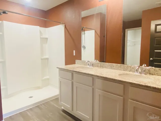 a bathroom with a bathtub and a sink