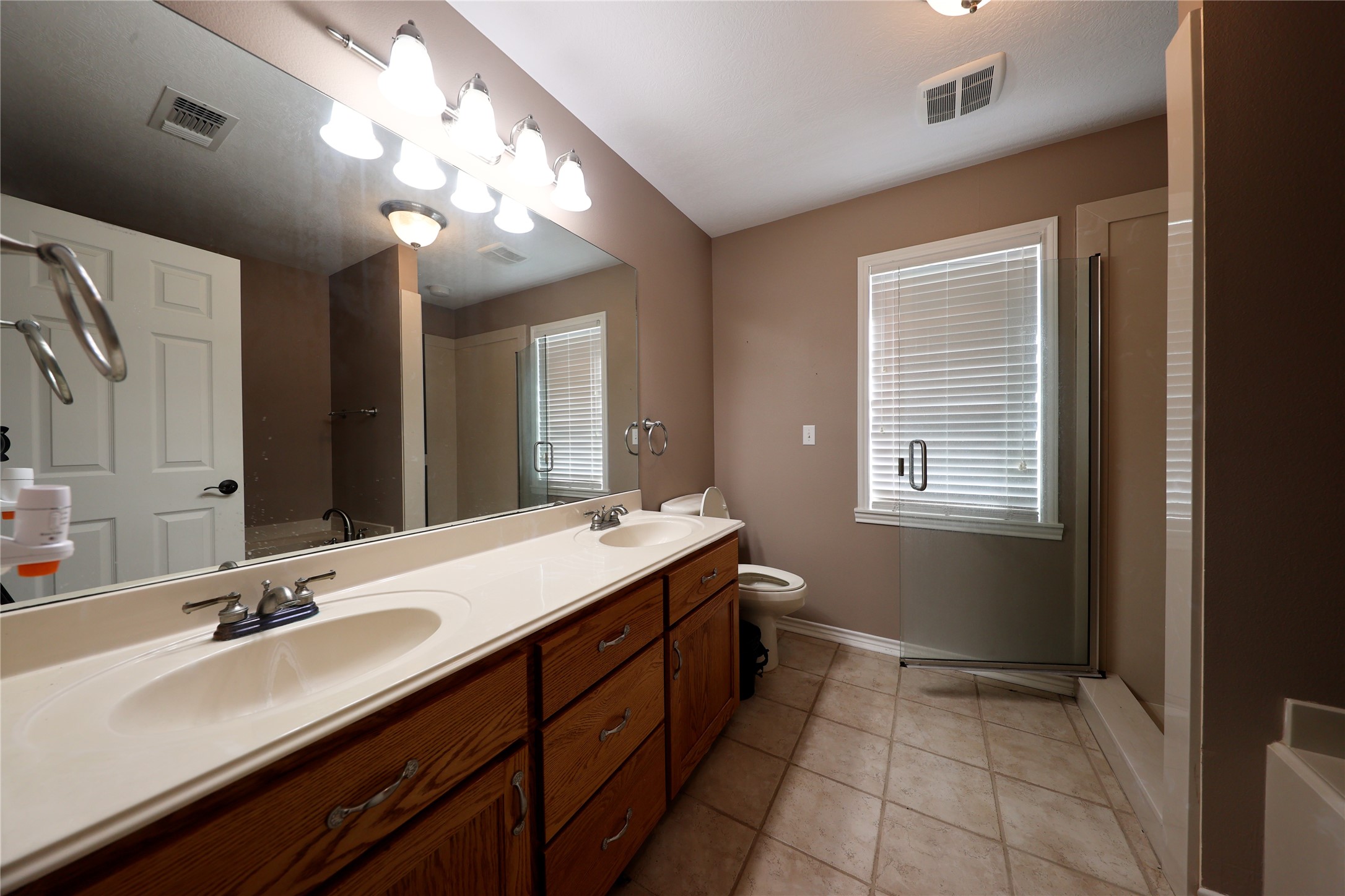 3337 Brunes Mill Road Columbus, TX 78934 - Photo 19 of 48 a bathroom with a sink double vanity and a mirror
