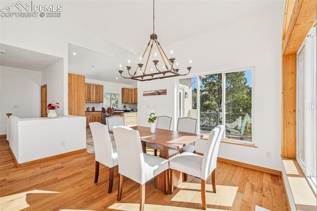 507 Yorktown Road Cripple Creek, CO 80813 - Photo 14 of 50 a view of a dining room with furniture wooden floor and windows