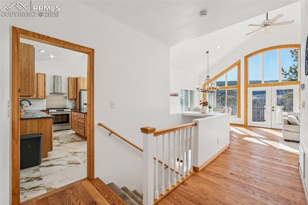507 Yorktown Road Cripple Creek, CO 80813 - Photo 15 of 50 a view of a hallway with wooden floor and staircase