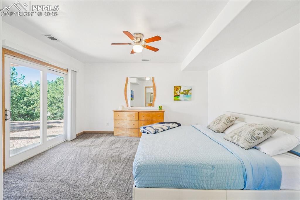 507 Yorktown Road Cripple Creek, CO 80813 - Photo 32 of 50 a bedroom with a bed and a window