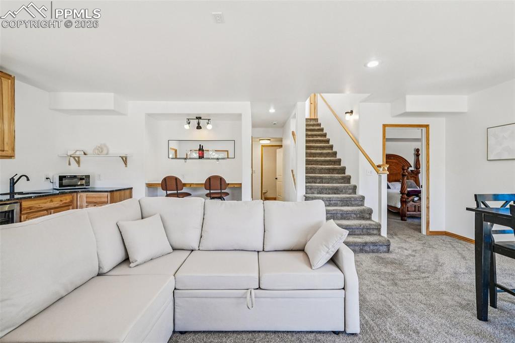 507 Yorktown Road Cripple Creek, CO 80813 - Photo 33 of 50 a living room with furniture and wooden floor