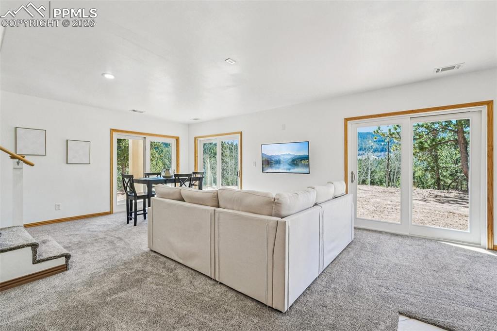 507 Yorktown Road Cripple Creek, CO 80813 - Photo 36 of 50 a living room with furniture and a large window