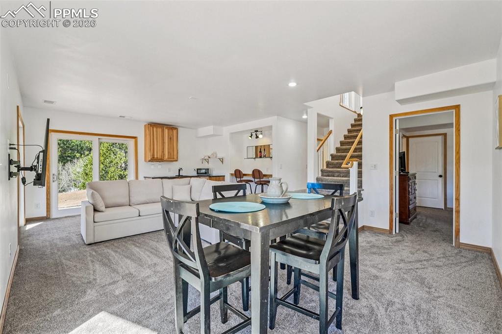 507 Yorktown Road Cripple Creek, CO 80813 - Photo 37 of 50 a dining room with furniture and a large window