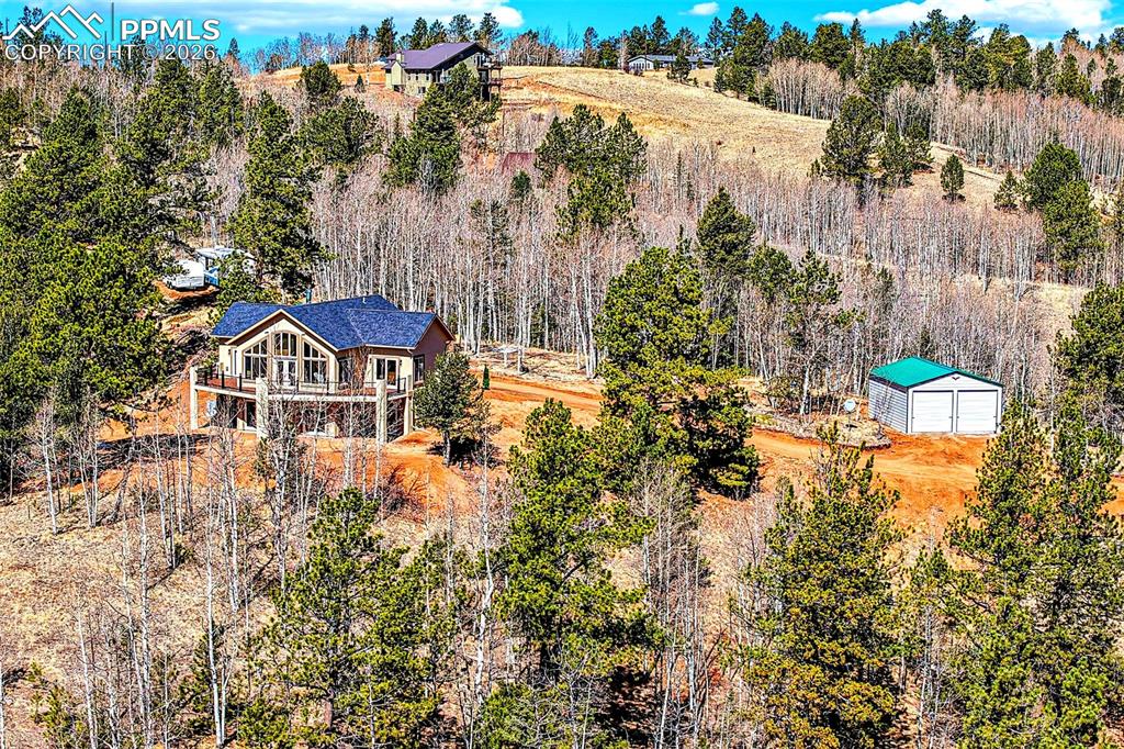 507 Yorktown Road Cripple Creek, CO 80813 - Photo 45 of 50 a view of a house with a yard and sitting area