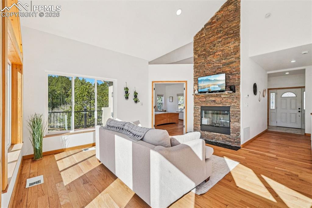 507 Yorktown Road Cripple Creek, CO 80813 - Photo 7 of 50 a living room with furniture and a fireplace