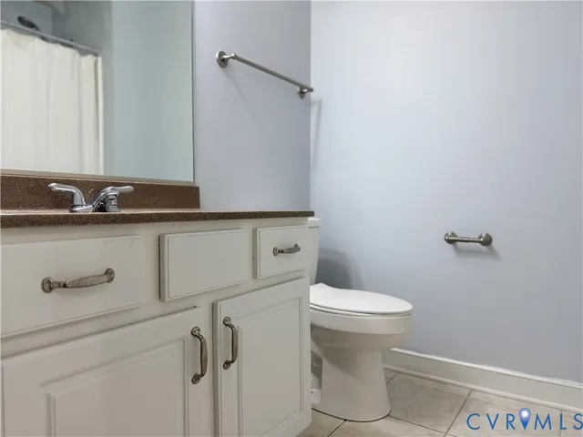 a bathroom with a sink a toilet and window