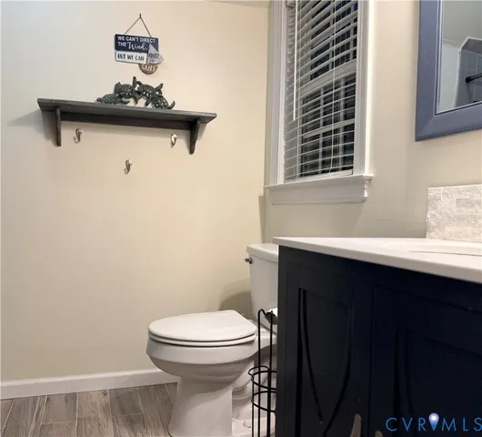 a bathroom with a toilet and a sink
