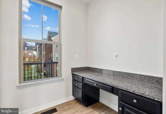 a view of kitchen and wooden floor