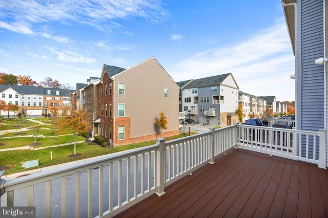 a view of a balcony with wooden floor