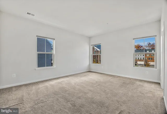 a view of a big room with windows and cabinet