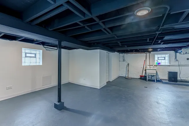 a view of empty room with wooden ceiling
