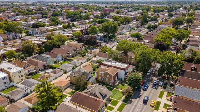 an aerial view of residential houses with outdoor space
