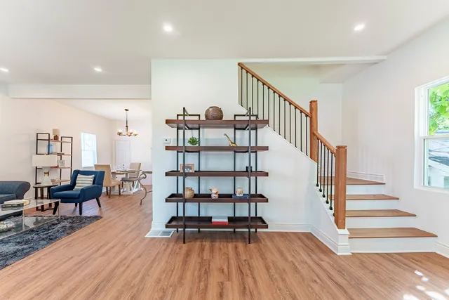 a view of entryway livingroom and hall with wooden floor