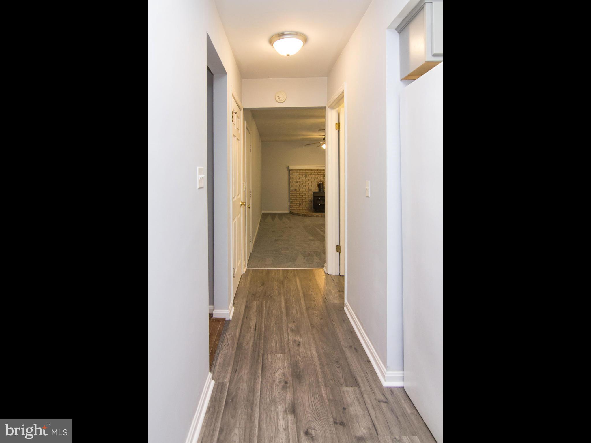 3923 London Bridge Road Finksburg, MD 21048 - Photo 12 of 30 New Laminate Floor Hall Kitchen to Family Room