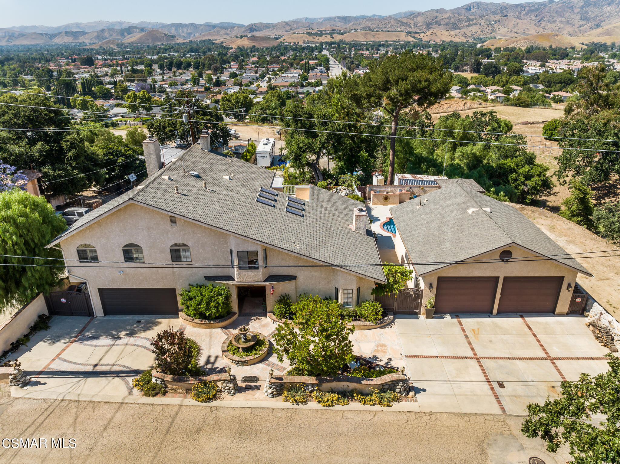 5765 Oak Knolls Road Simi Valley, CA 93063 - Photo 1 of 71 an aerial view of a house with a yard and a large tree