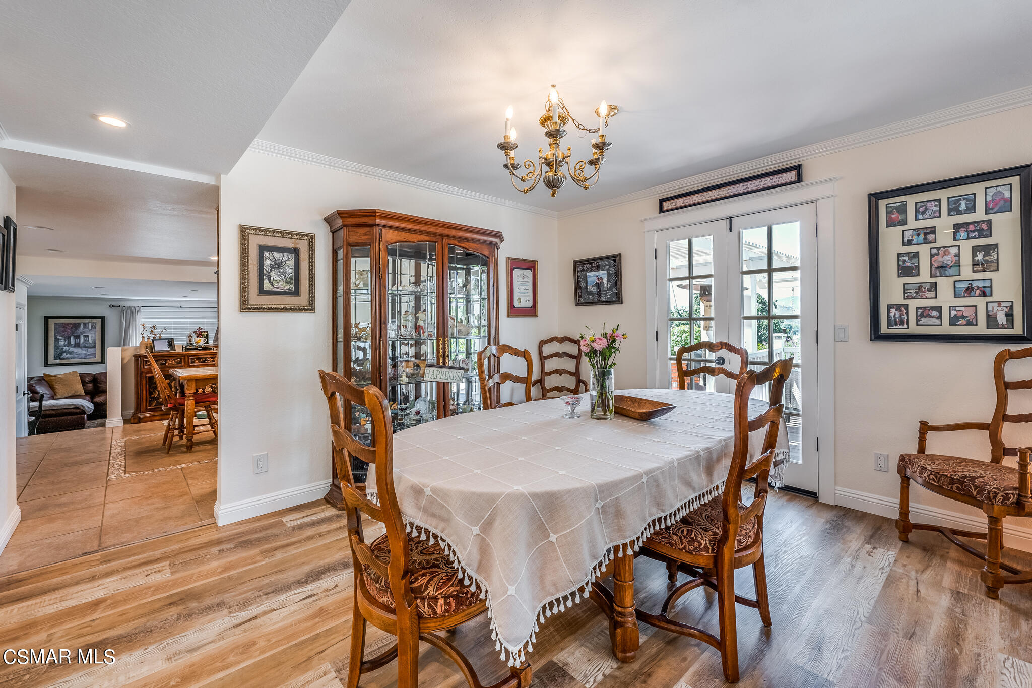 5765 Oak Knolls Road Simi Valley, CA 93063 - Photo 17 of 71 a view of a dining room with furniture wooden floor and chandelier