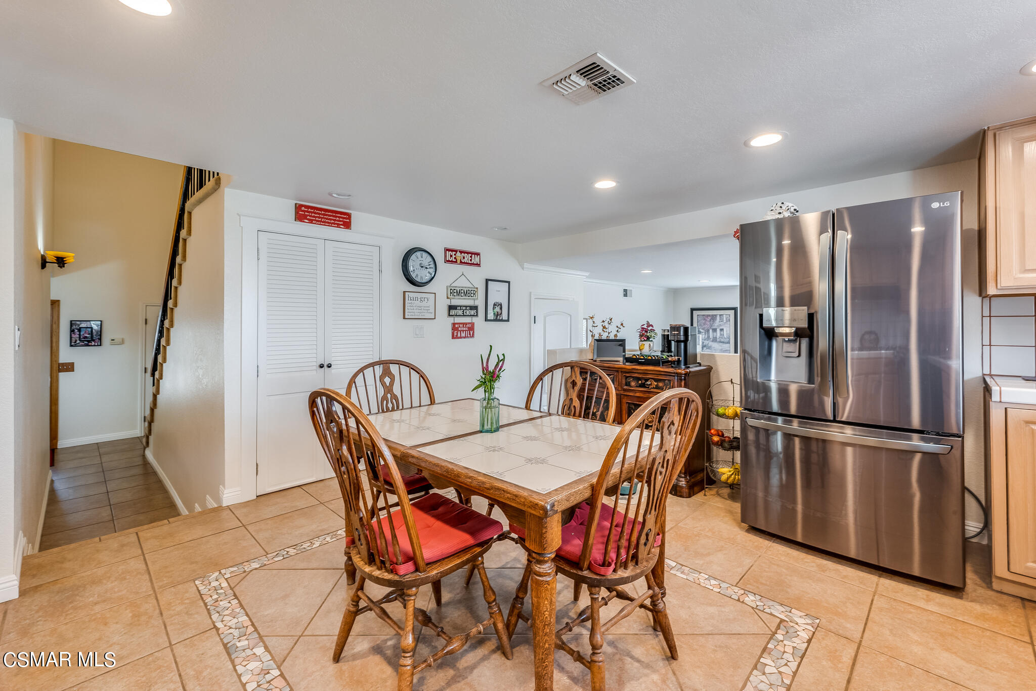 5765 Oak Knolls Road Simi Valley, CA 93063 - Photo 23 of 71 a kitchen with stainless steel appliances granite countertop a dining table and chairs