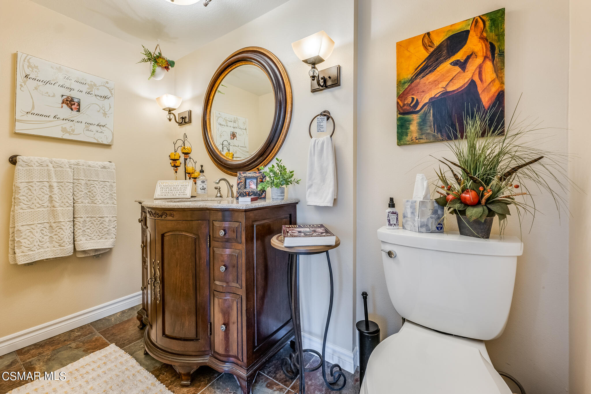 5765 Oak Knolls Road Simi Valley, CA 93063 - Photo 26 of 71 a bathroom with a toilet a sink and a mirror