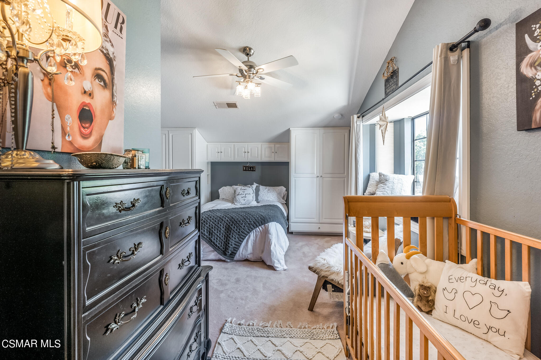 5765 Oak Knolls Road Simi Valley, CA 93063 - Photo 33 of 71 a bedroom with furniture and a chandelier
