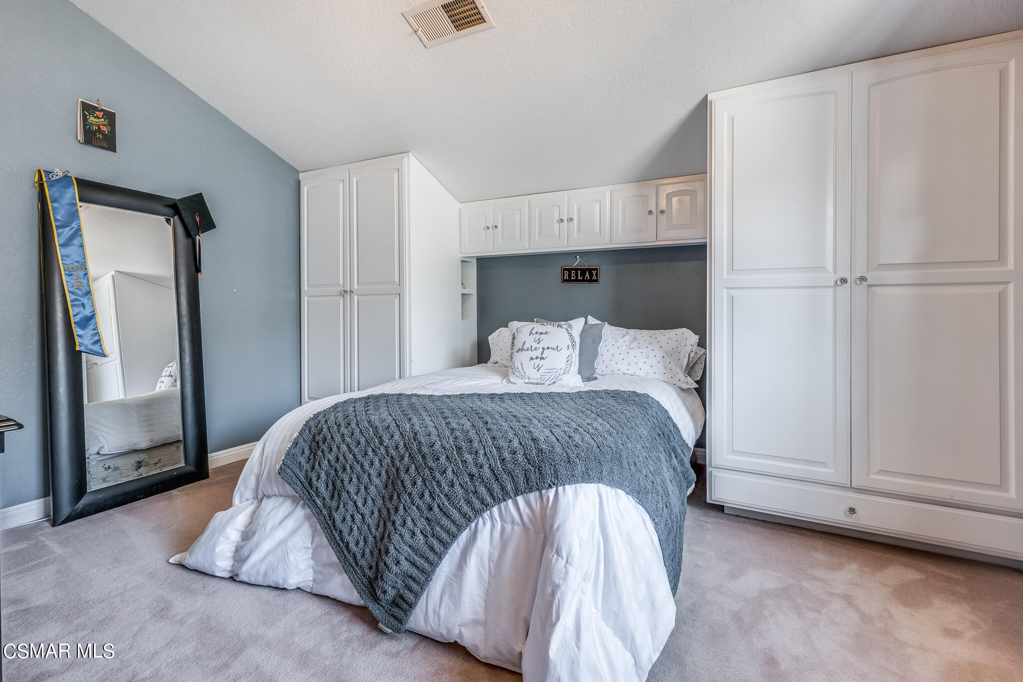 5765 Oak Knolls Road Simi Valley, CA 93063 - Photo 34 of 71 a bedroom with a bed and a mirror