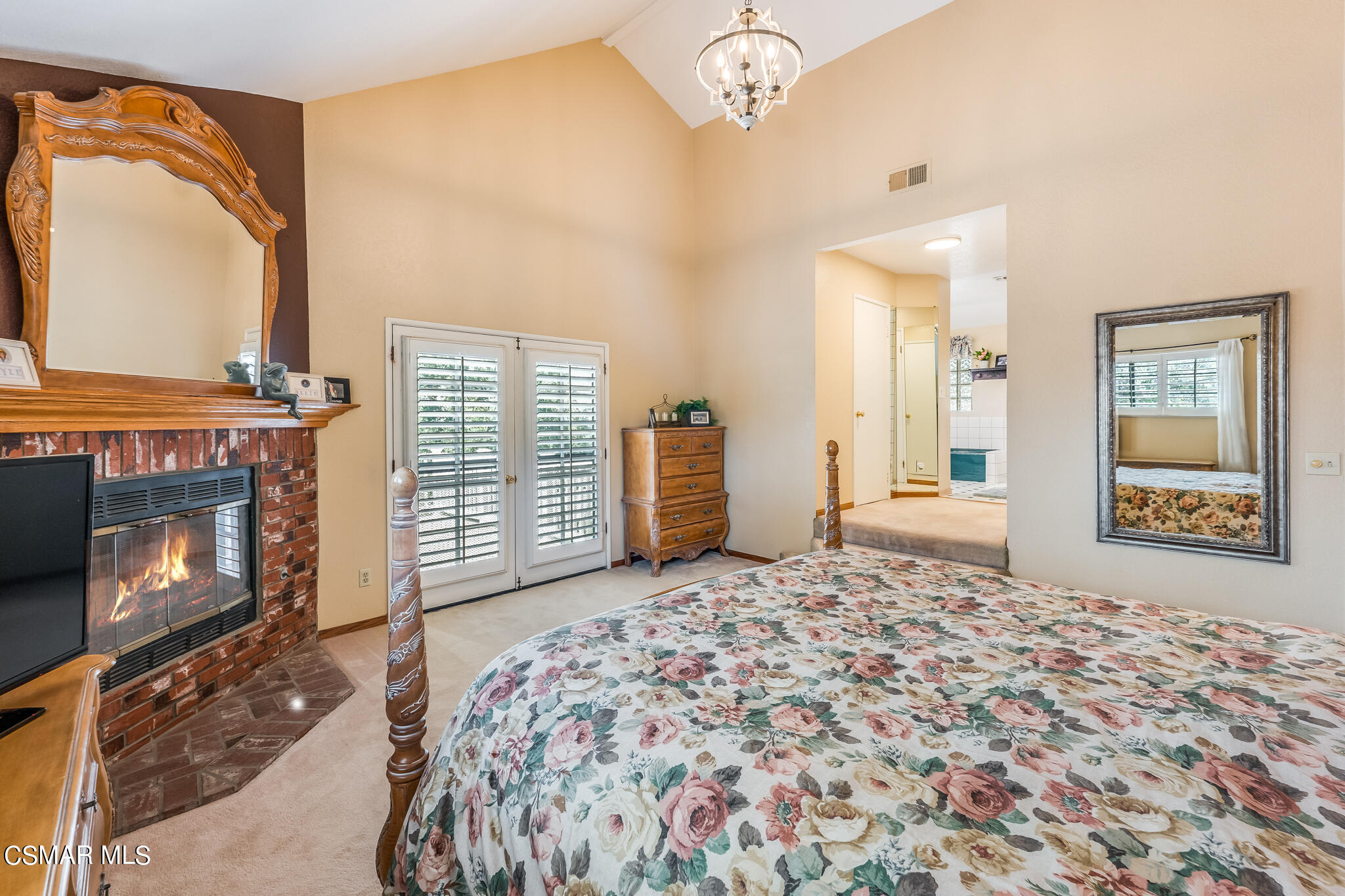 5765 Oak Knolls Road Simi Valley, CA 93063 - Photo 41 of 71 a spacious bedroom with a bed and a fireplace