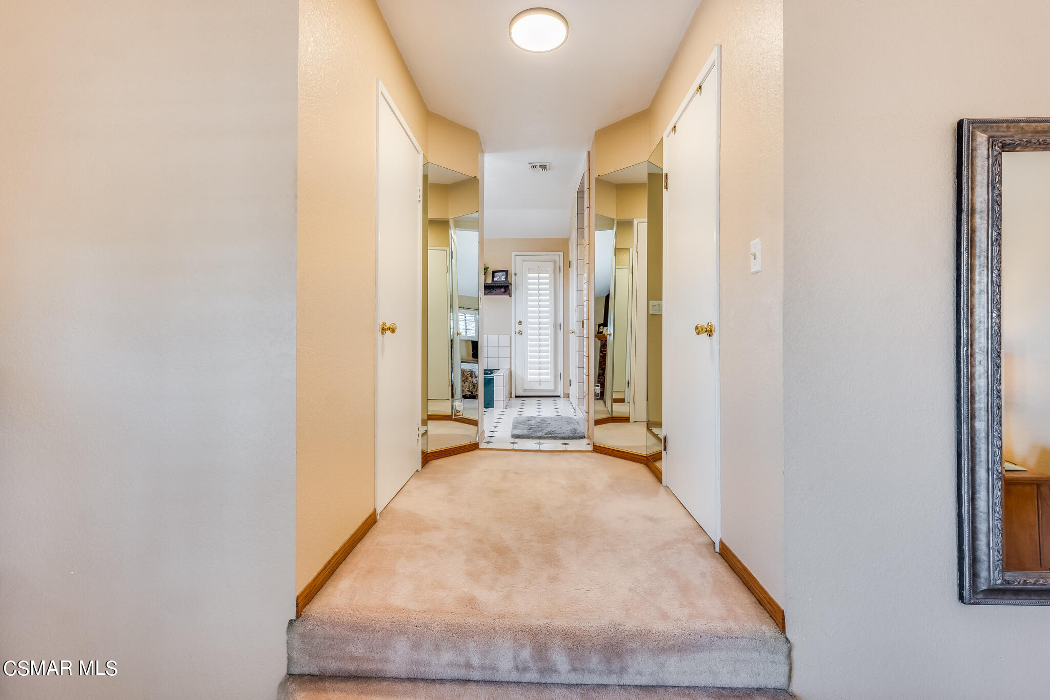 5765 Oak Knolls Road Simi Valley, CA 93063 - Photo 42 of 71 a view of a hallway with wooden floor and a bathroom