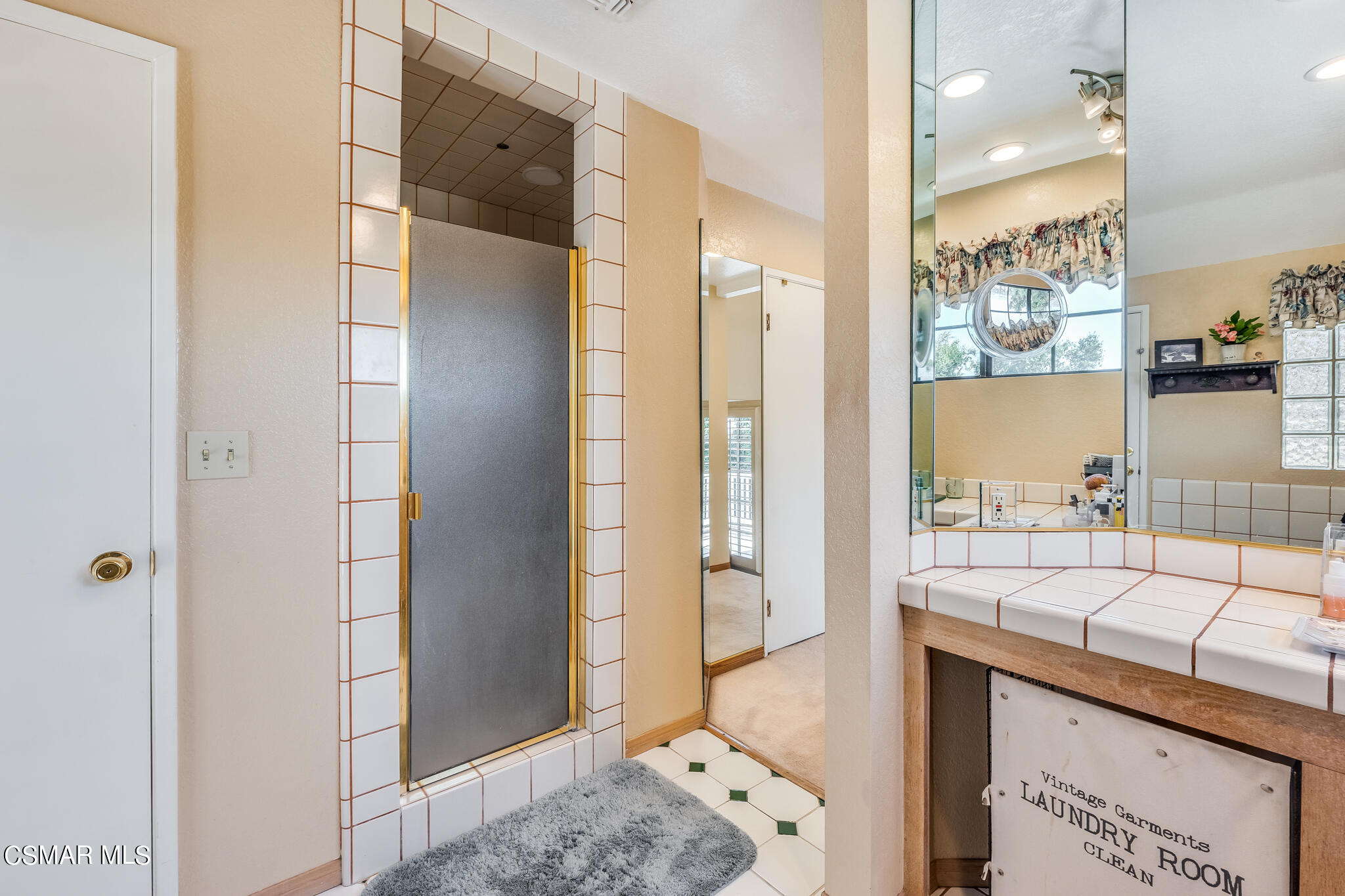 5765 Oak Knolls Road Simi Valley, CA 93063 - Photo 48 of 71 a spacious bathroom with a shower and a sink