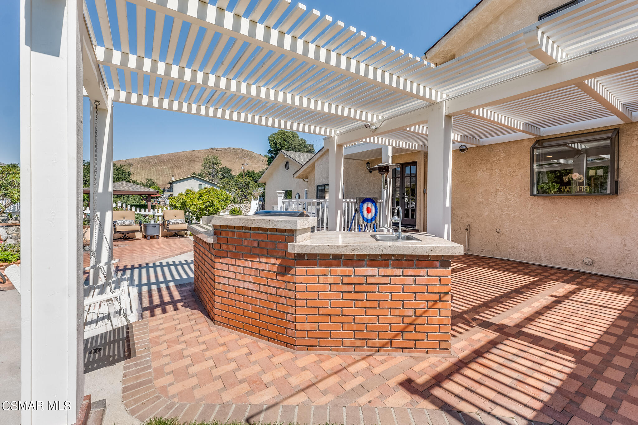 5765 Oak Knolls Road Simi Valley, CA 93063 - Photo 56 of 71 a view of an chairs and table in a patio